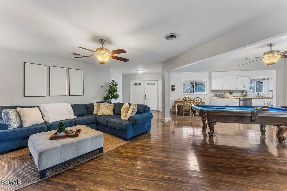 Unwind in your spacious living area where plush seating meets entertainment, with a pool table ready for friendly games.