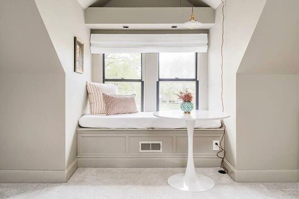 Primary Suite | Master bed, twin day bed, bistro table sitting area