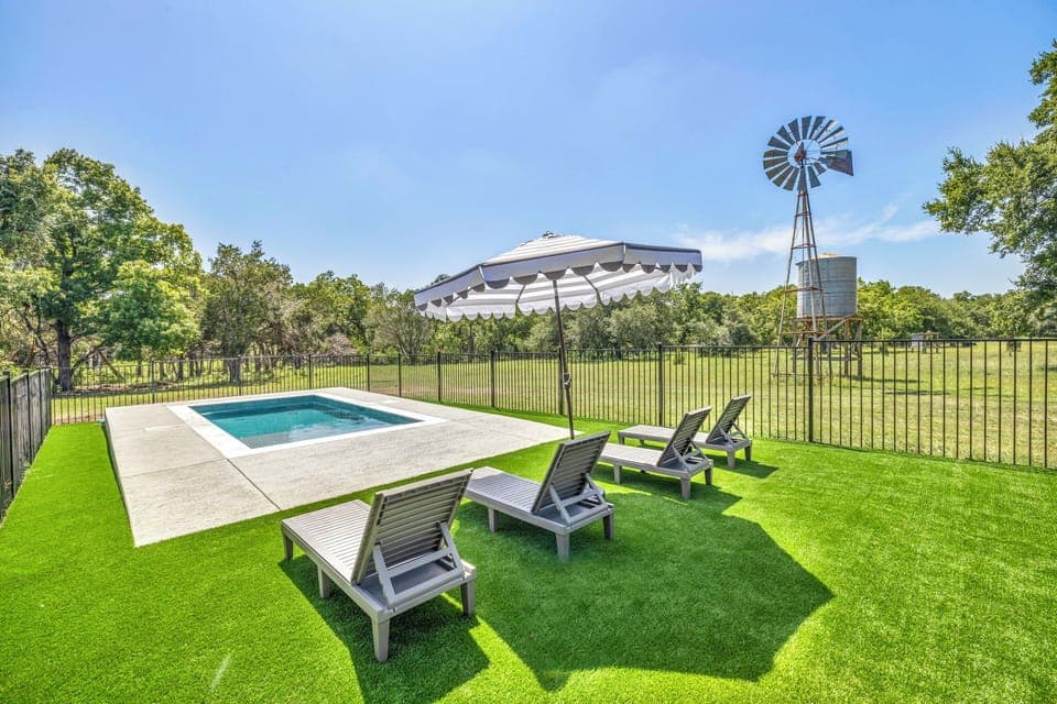 Amazing and fully fenced pool area with turf. Heated-capable pool.