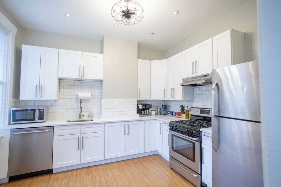 Fully equipped kitchen with modern appliances, including a stove, oven, refrigerator, microwave, and all the cookware and utensils you need to prepare and enjoy your meals.