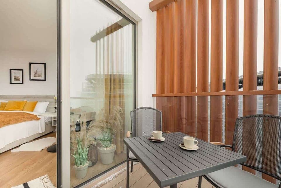 The balcony provides a perfect spot for enjoying the fresh air. 