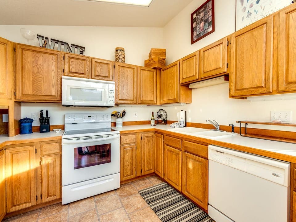 Fully equipped kitchen open to the dining room.