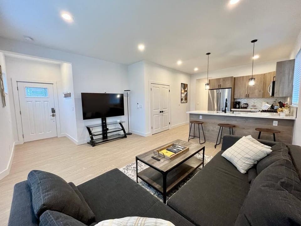 Relax in our stylish living room with state-of-the-art TV for viewing pleasure.