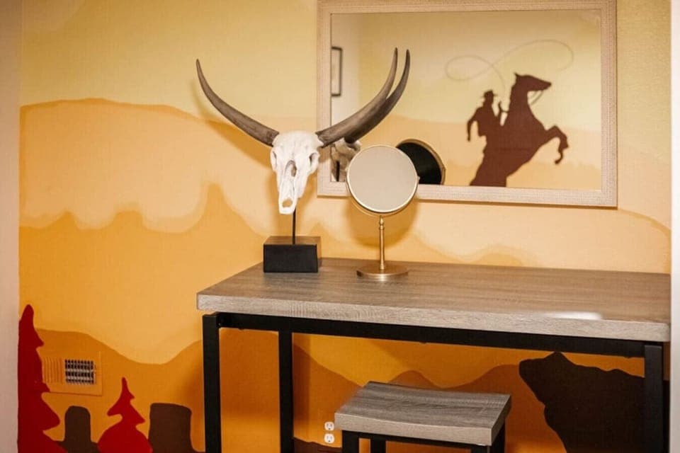 Western-themed bedroom with dedicated high-top desk – perfect for remote work or studying