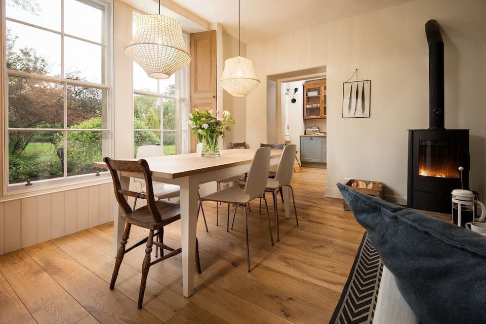 The Trouthouse - the open-plan living space leads through from the kitchen and benefits from a large bay window overlooking the owner's garden to the rear