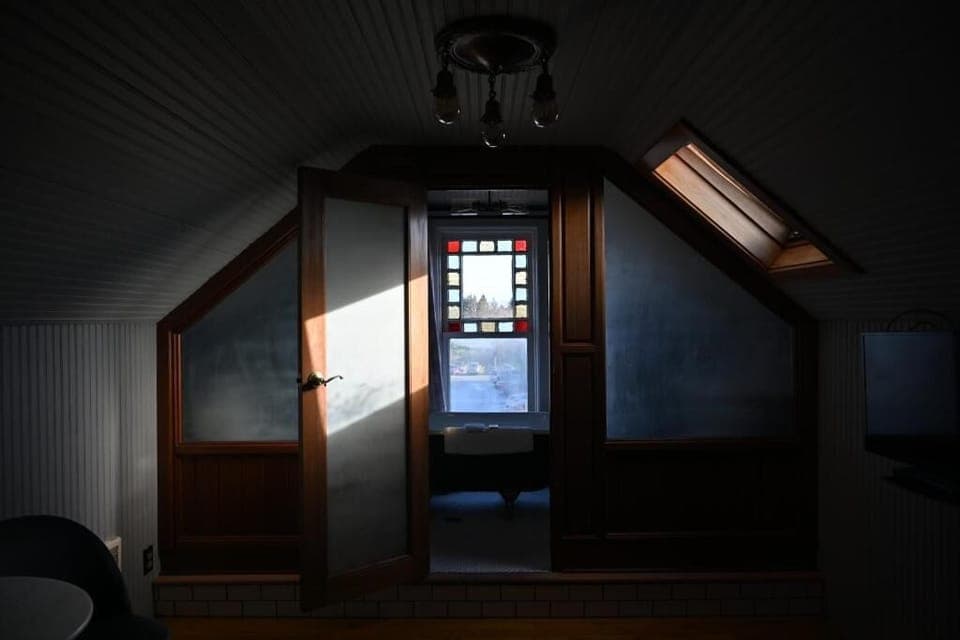 Wind down in the loft with moody light and quiet privacy.
