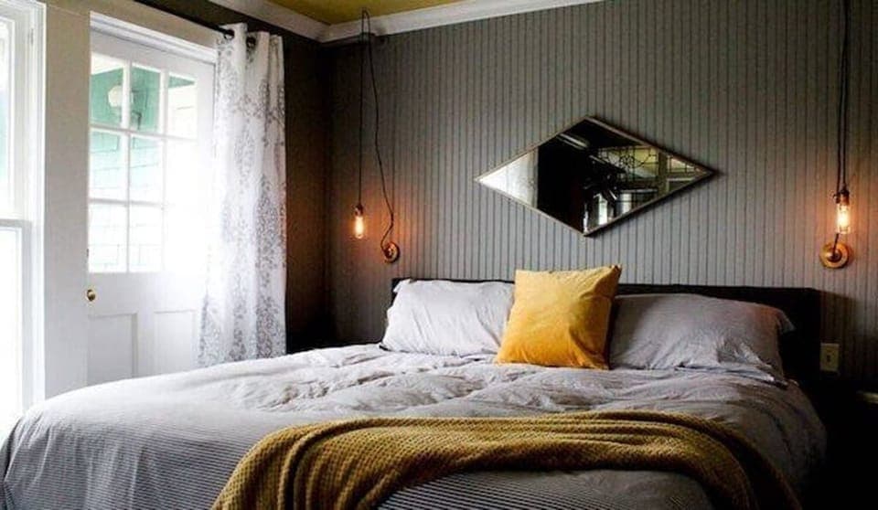 Unwind in crisp linens with cozy throws and soft light.