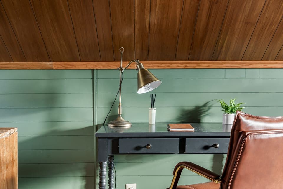 Dedicated workspace in bedroom 3/attic with sleek table and chair
