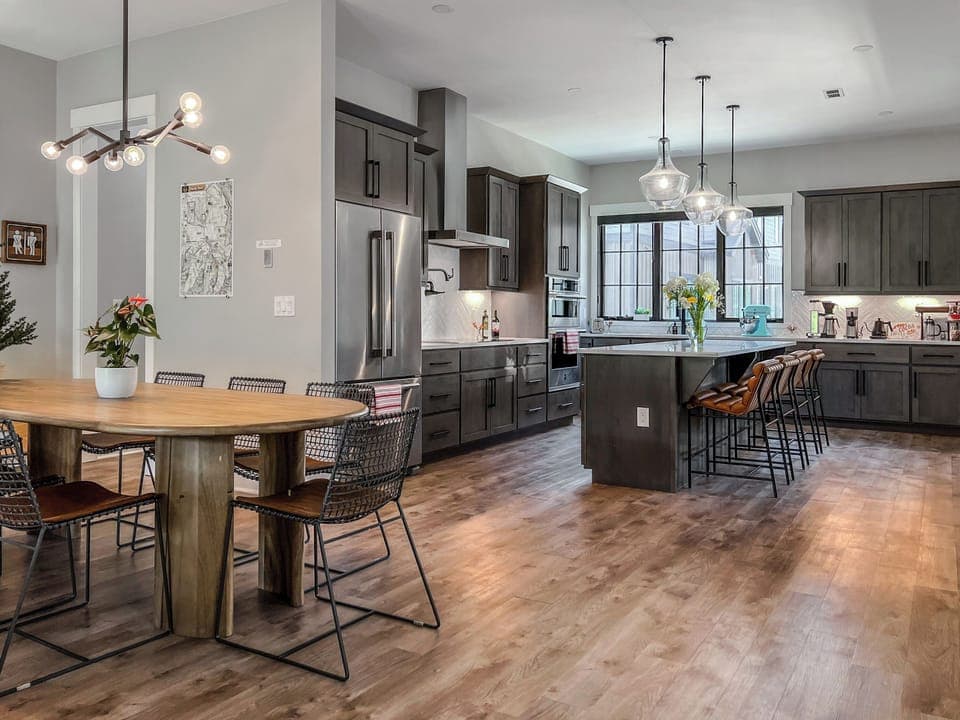 - Open kitchen and dining layout offers space to gather and connect easily - Warm hardwood floors and pendant lights create a welcoming modern vibe - Cook, dine, and unwind all in one bright and stylish central setting