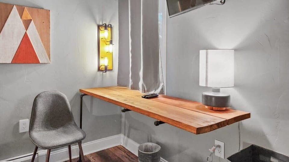 The wall-mounted desk in the second bedroom offers a quiet spot to catch up on any remote work needs.