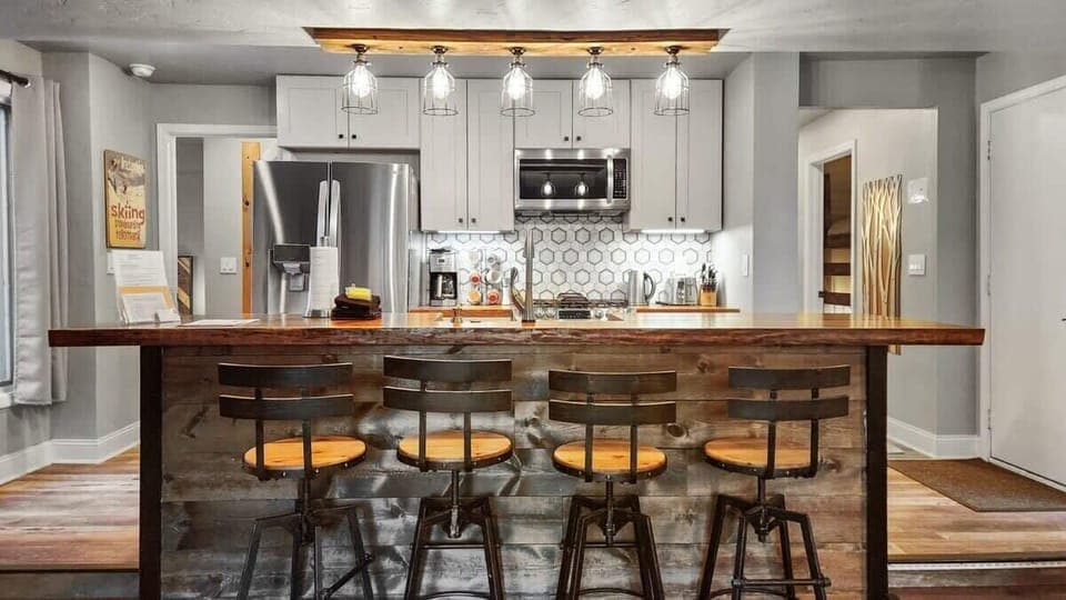 Prepare delicious meals and quick snacks in the gorgeous kitchen where you will find brand-new appliances, a range of cookware, and a beautiful kitchen bar with 4 barstools.