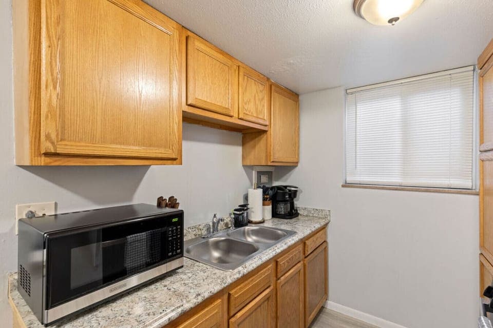 Ensure the cleanliness of your food in this kitchen, equipped with a sink for your convenience