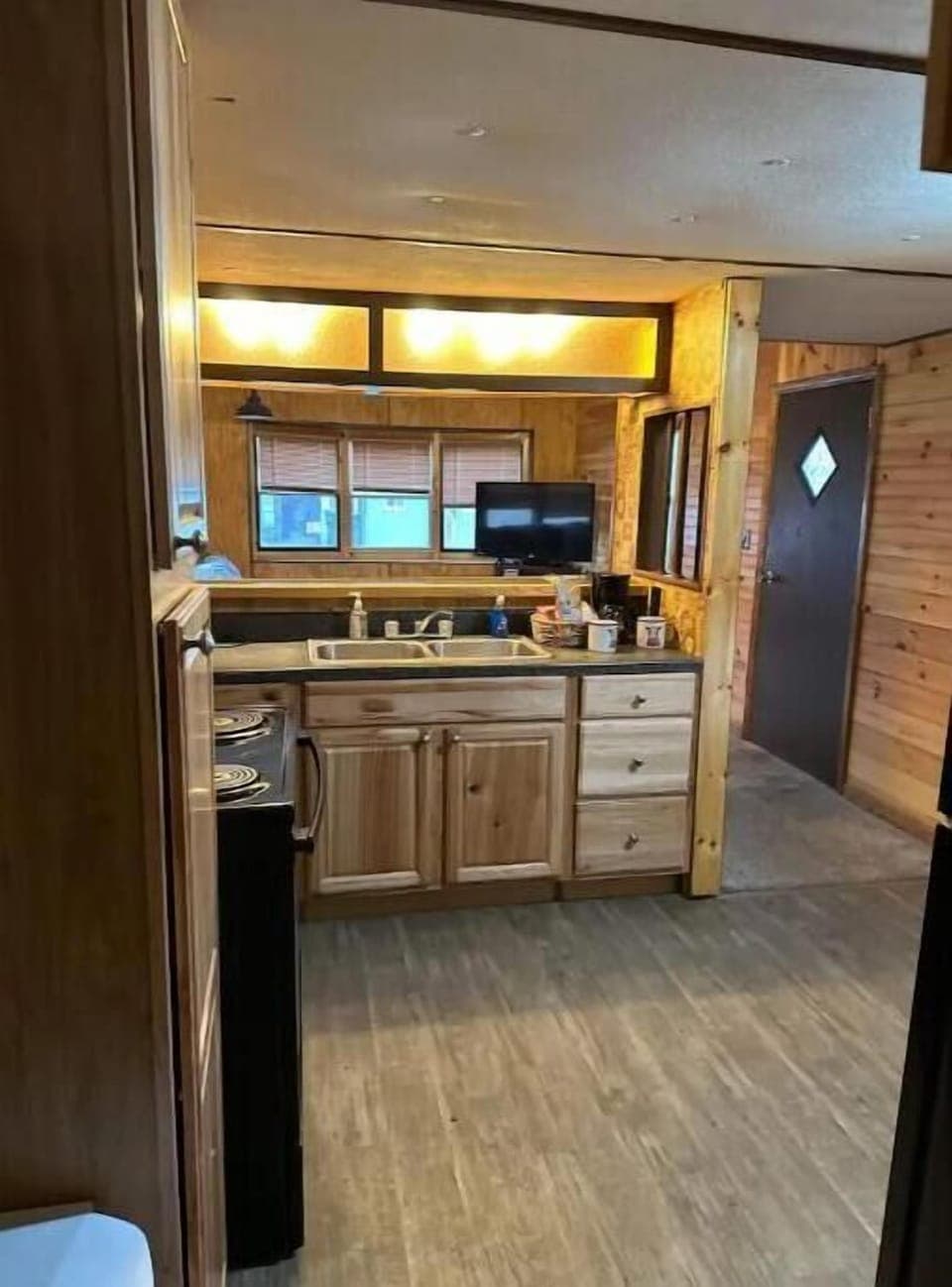 Full kitchen, awesome cabinets, full stove and refrigerator.