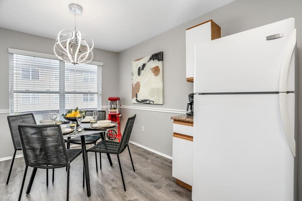 Step into the spotlight of this well-lit kitchen, where a full-size fridge keeps your breakfast of champions chilled and ready to fuel your day with a grin!
