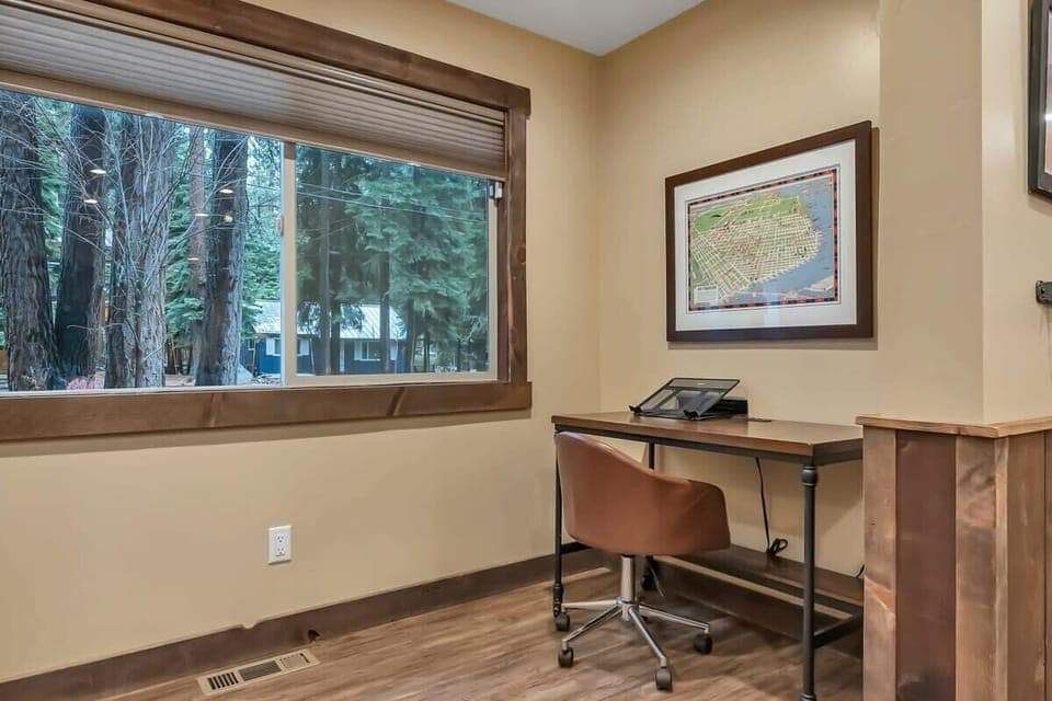 A cozy workspace is tucked off the kitchen offering a quiet area to keep up with any remote work needs.