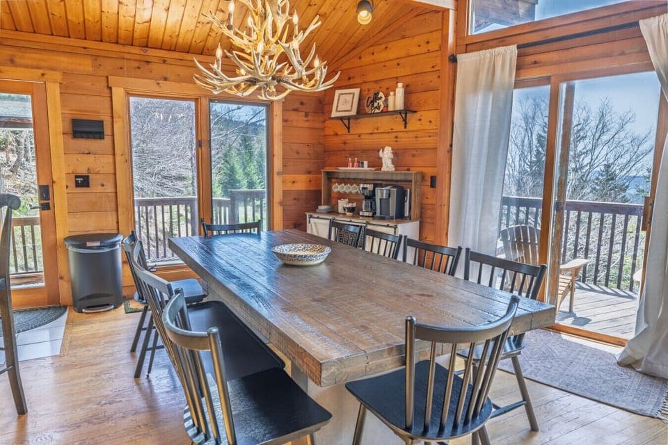 Gather around the oversized dining table for meals, games, and mountain memories