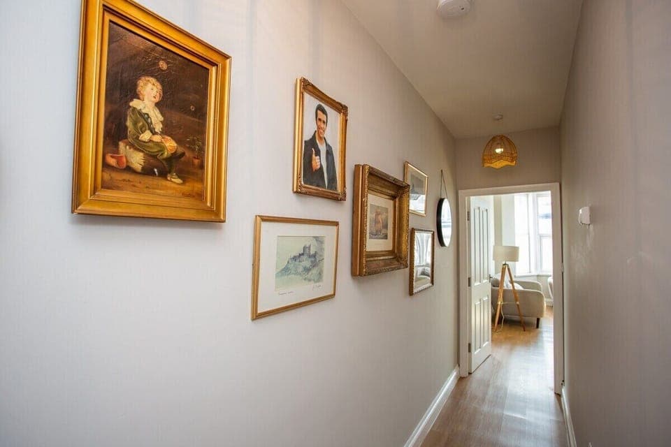 Whether you're admiring the artwork or simply taking in the sights and sounds of the sea, this hallway sets the stage for a memorable stay.