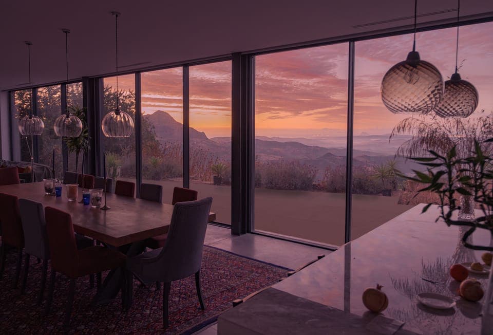 The dining table and terrace from the kitchen on a beautiful autumn morning
