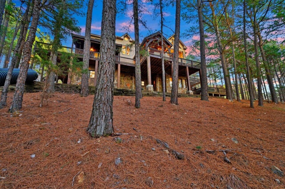 Nestled amidst towering pine trees, this quaint cabin offers a serene retreat in the heart of nature.