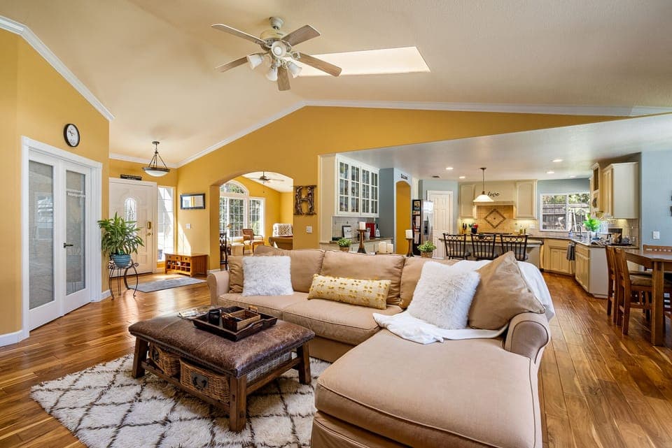 Loving room with view of kitchen and pool room