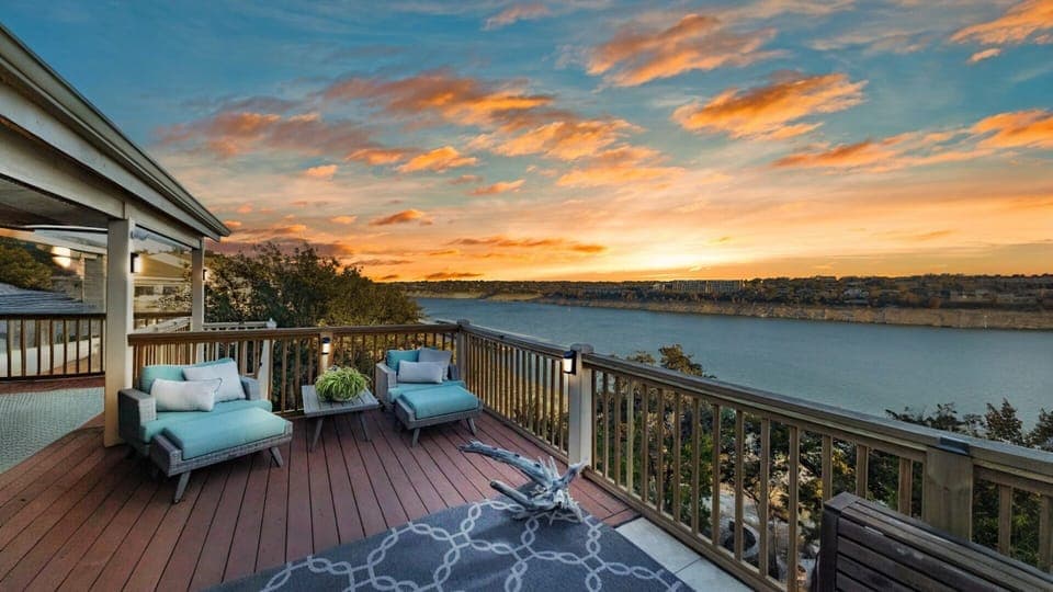 Main level Balcony overlooking Lake Travis, with a seating area perfect for taking in the sunset.