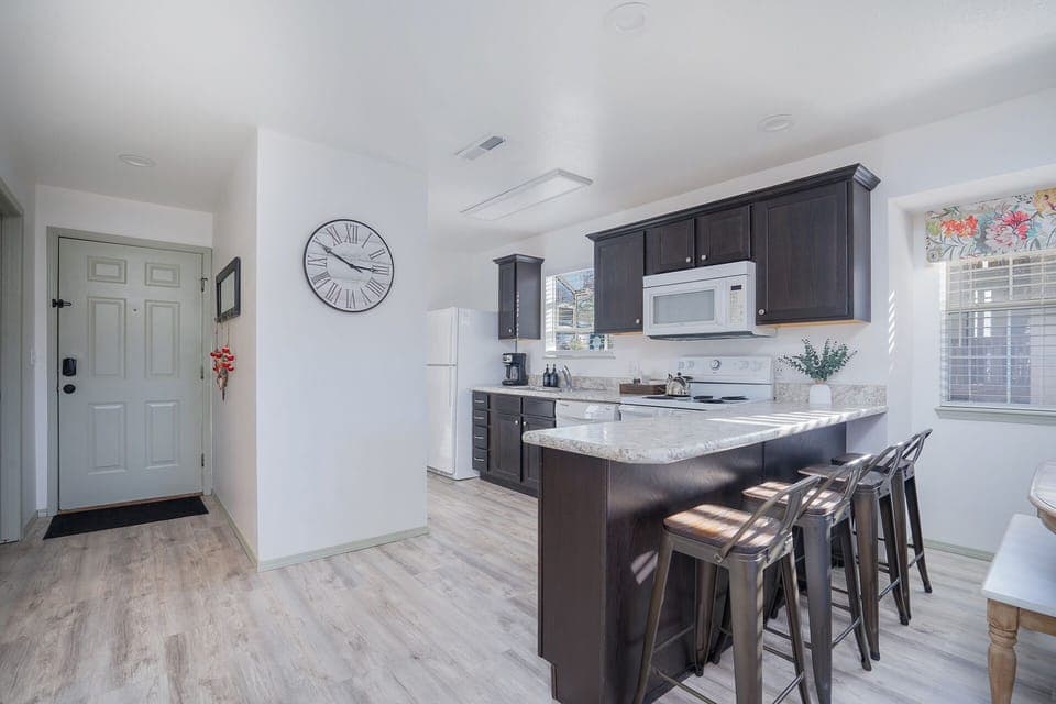 Whip up a delicious meal in the fully equipped kitchen - the heart of your cozy condo that's sure to inspire your inner chef!