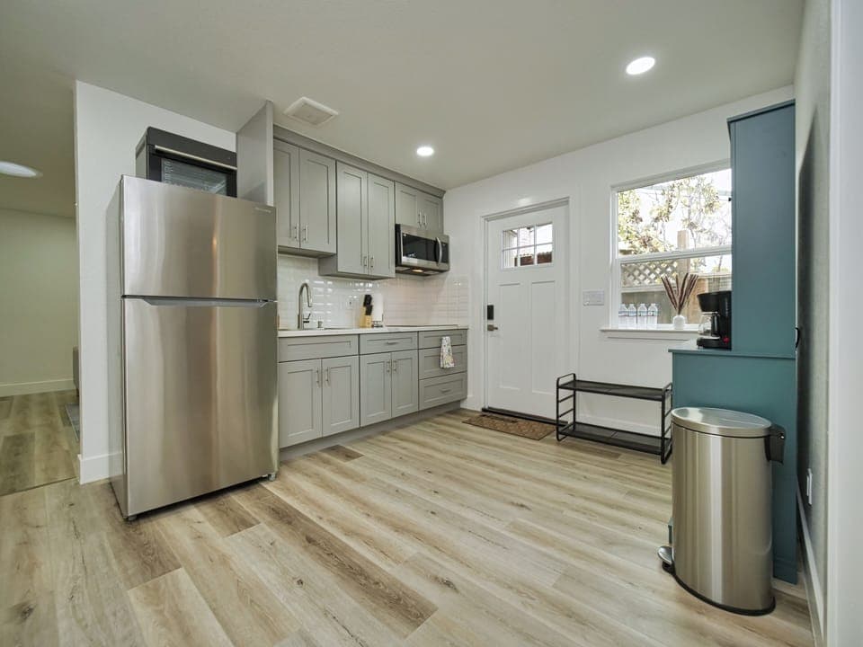 Fully stocked kitchen with all brand new appliances which includes 4 burner stove, microwave, oven.