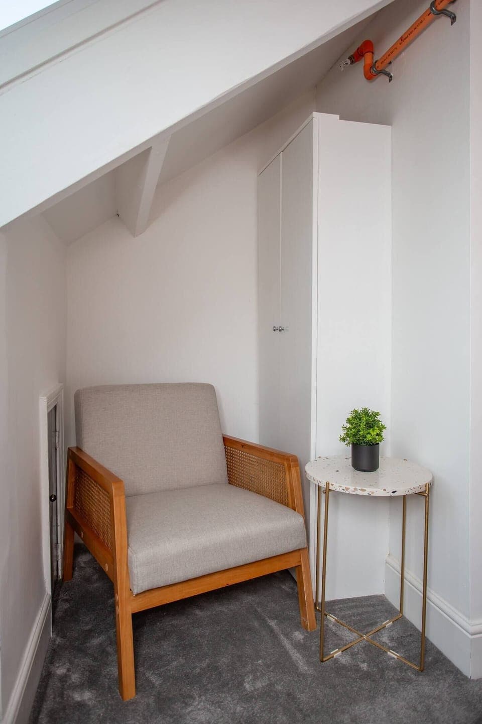  Immerse yourself in a world of imagination and serenity in the tranquil reading space of our coastal-inspired apartment. 