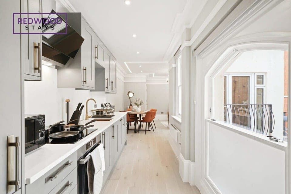 SLEEK AND MODERN KITCHEN AND DINING AREA