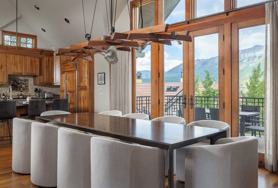 Kitchen - Fully stocked with serving items and extra appliances with bar stool seating at island for 4