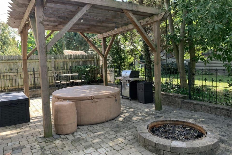 Madison Manor I—shared patio with hot tub, fire pit, & grill