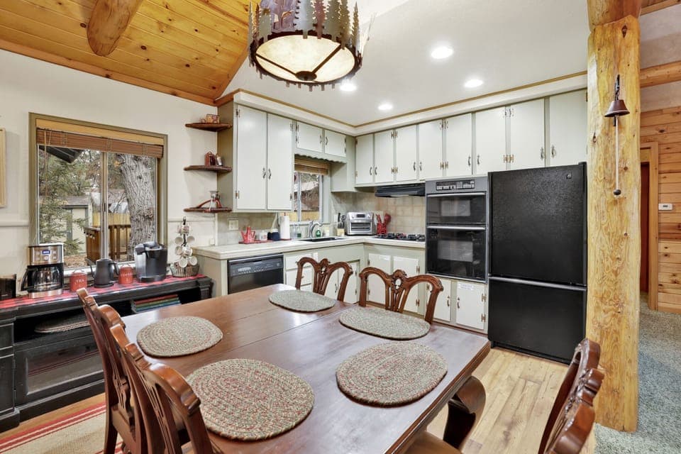 Inviting dining area with elegant table setting, warm lighting, and space for shared meals and gatherings