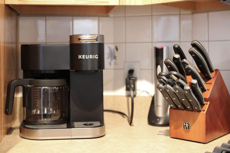 The kitchen has a combo drip coffee and Keurig pods 