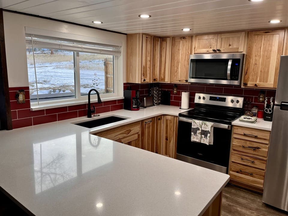 Beautifully updated kitchen with spacious quarts countertops