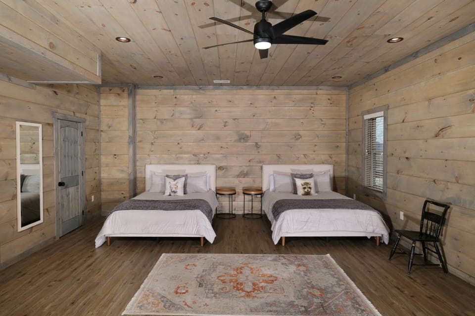 Two Queen beds in downstairs bonus/game room. 