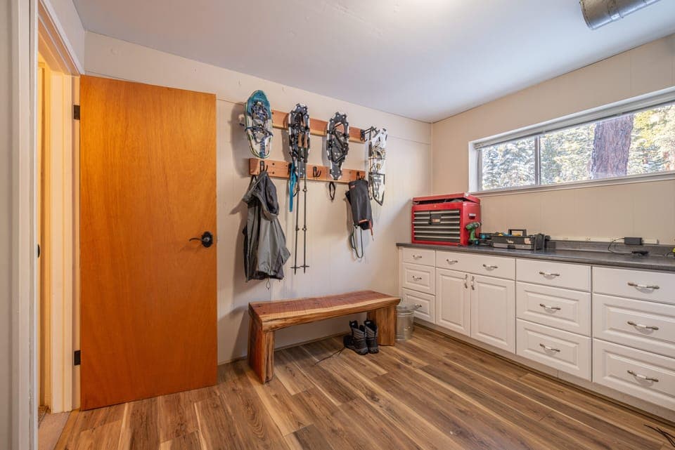 Mud room accessed from the lower covered entry with lots of hooks and racks for your toys and clothing