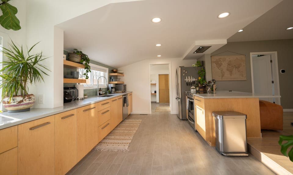 Kitchen fully stocked with modern, stainless steel amenities, ready to use