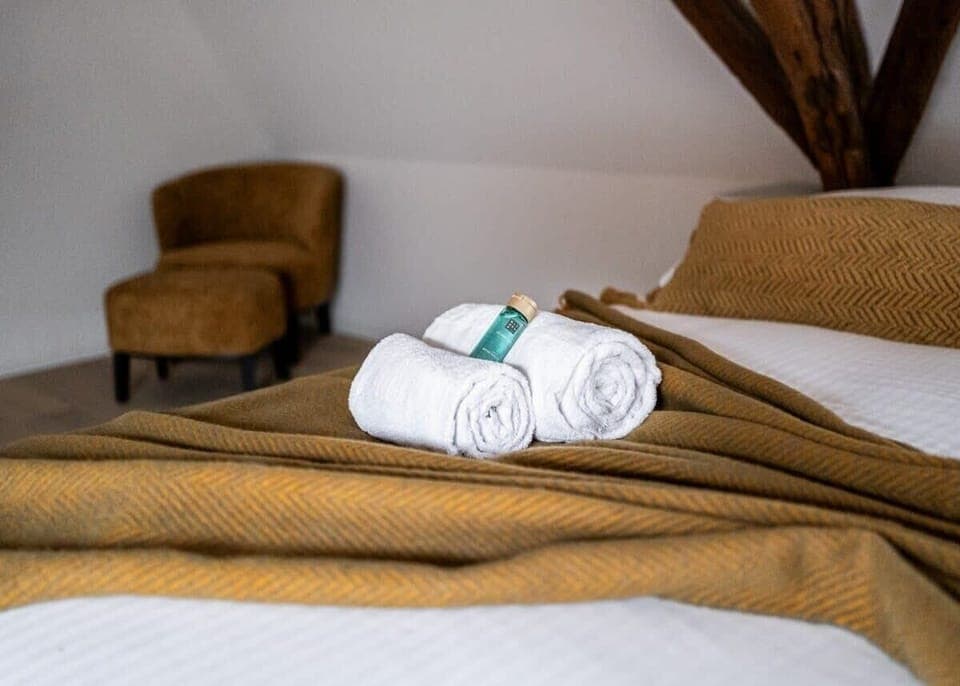 Enchanting mezzanine bedroom with rustic wooden beams
