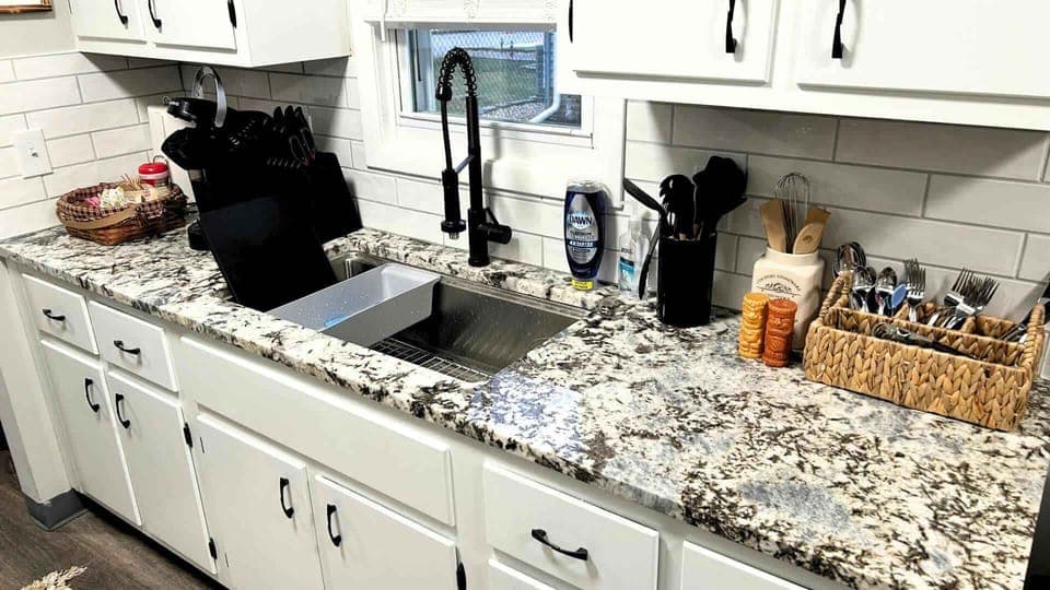 The fully functional kitchen is equipped with everything you need to cook up delicious meals, featuring modern appliances, ample counter space, and all the essentials. Whether you're preparing a quick snack or a gourmet dinner, it has you covered!