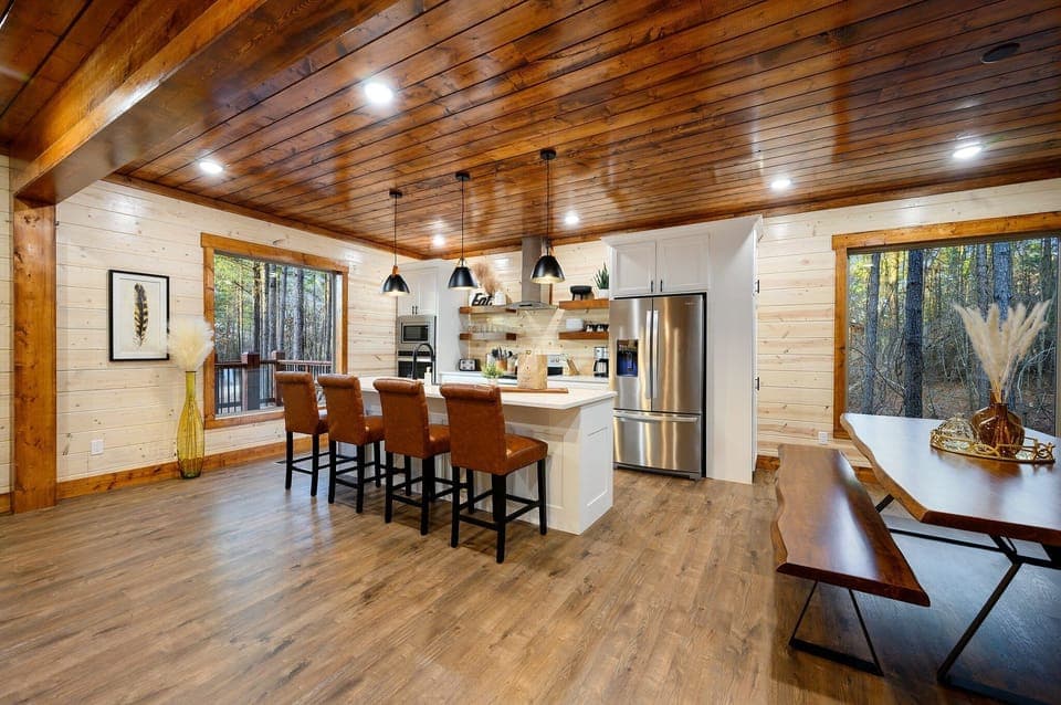 The kitchen has seating for 14 including the formal dining table and bar top.