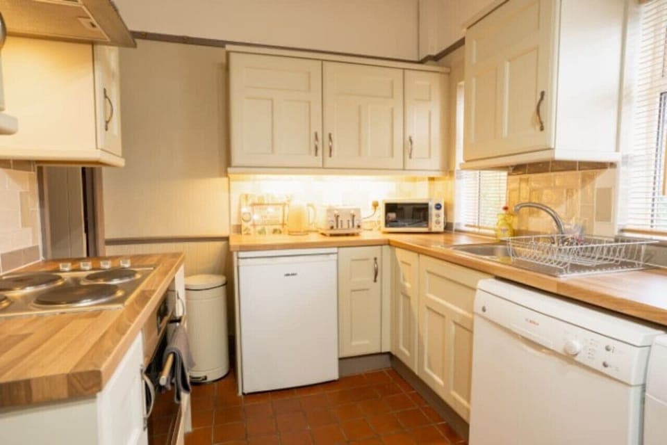 The Kitchen: the lovely shaker style kitchen comes well equipped with everything you need for a comfortable stay.