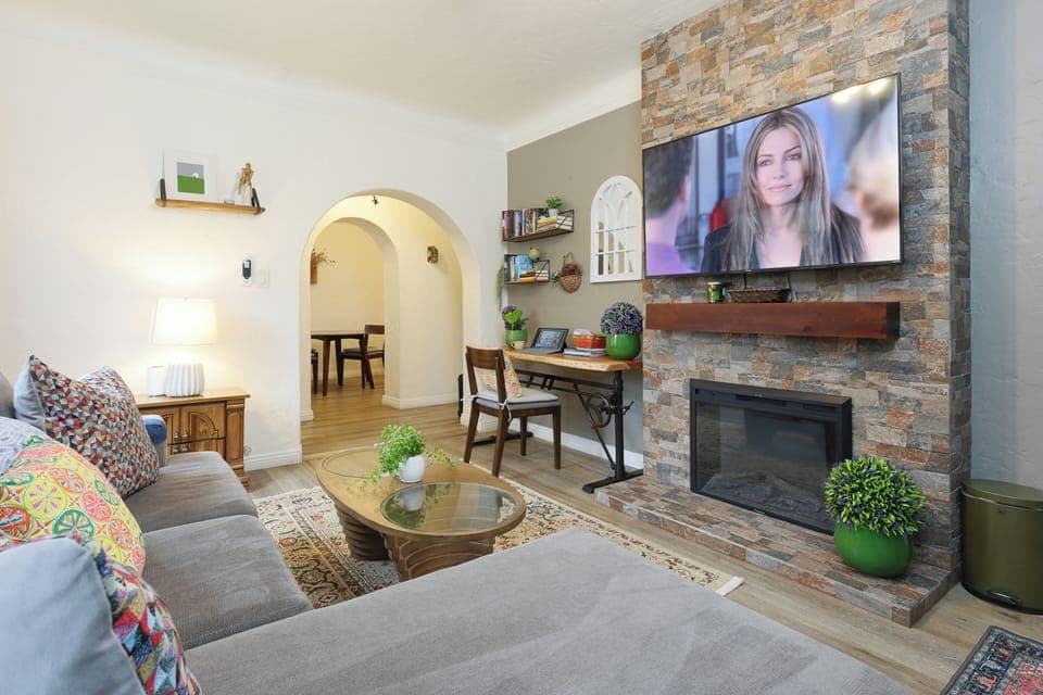 Relax and recharge in our stylish living room with adjustable table