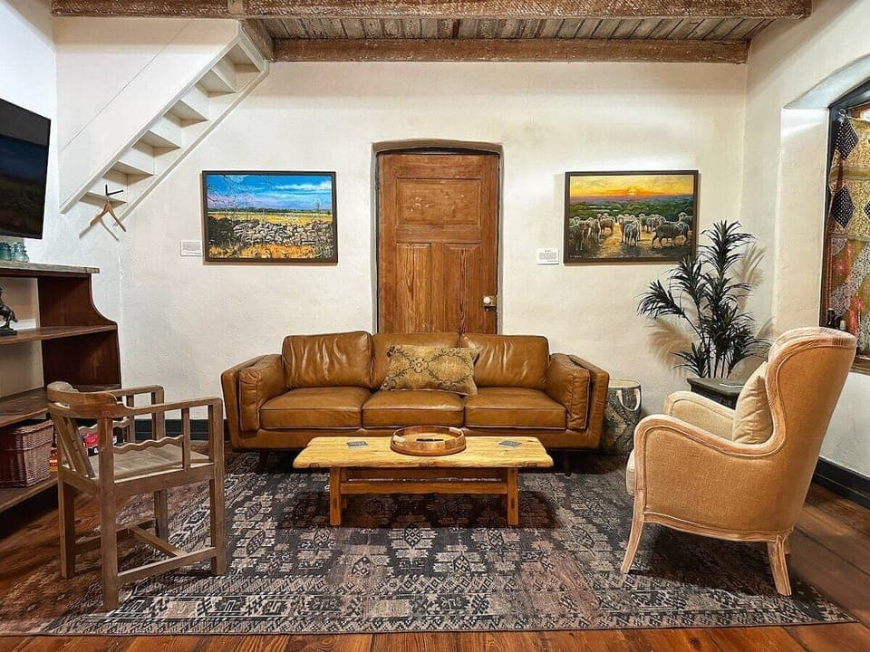 Gather around for family game night in the inviting living room, complete with board games and comfortable seating.