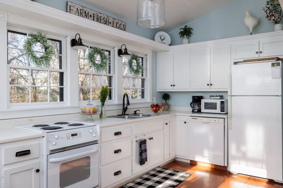 Savor the joys of home cooking in the stylish kitchen, stocked with all the essentials and adorned with charming details for a delightful experience.