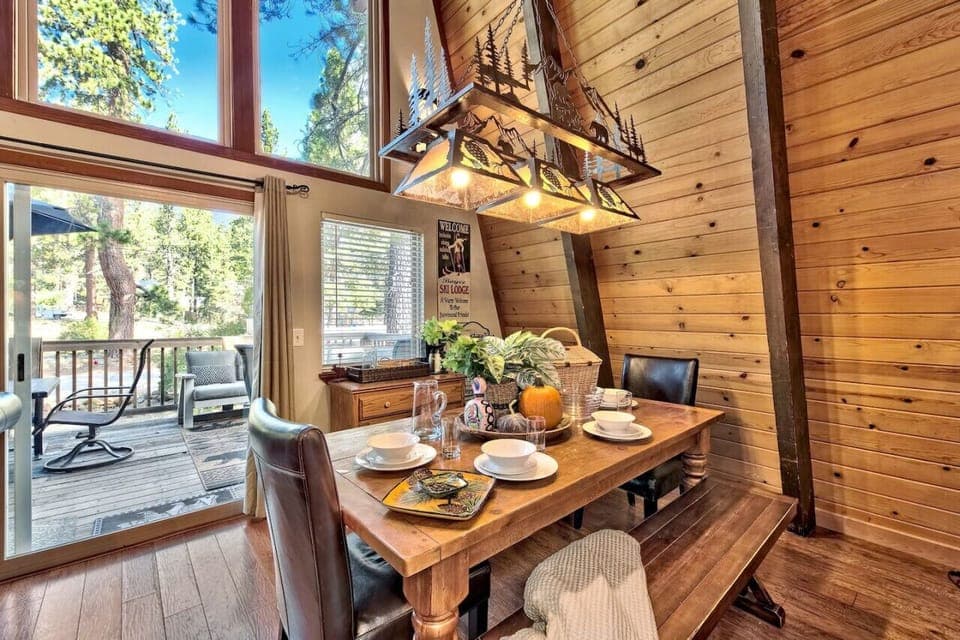 Dining table on main / mid level (seats 8).  There’s also bar seating for 3 and another small table that seats 4 adjacent to living area.