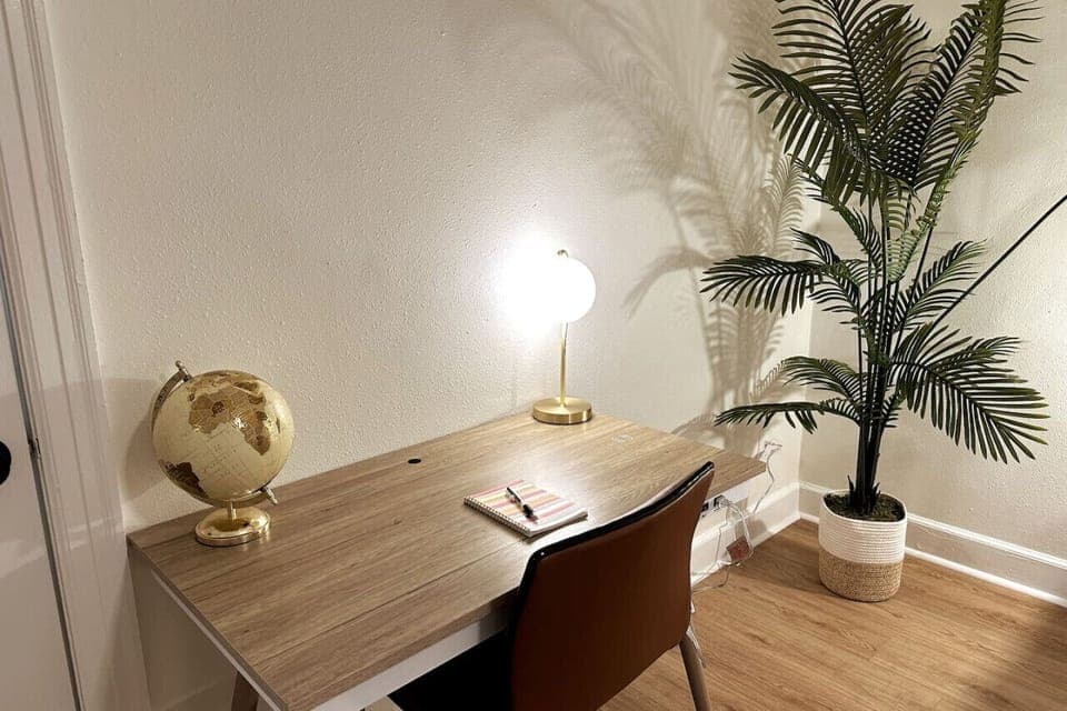 Boost your productivity in our cozy bedroom retreat with a small desk area. Whether you're working remotely or planning your next adventure, find inspiration in this tranquil corner of our Airbnb oasis.