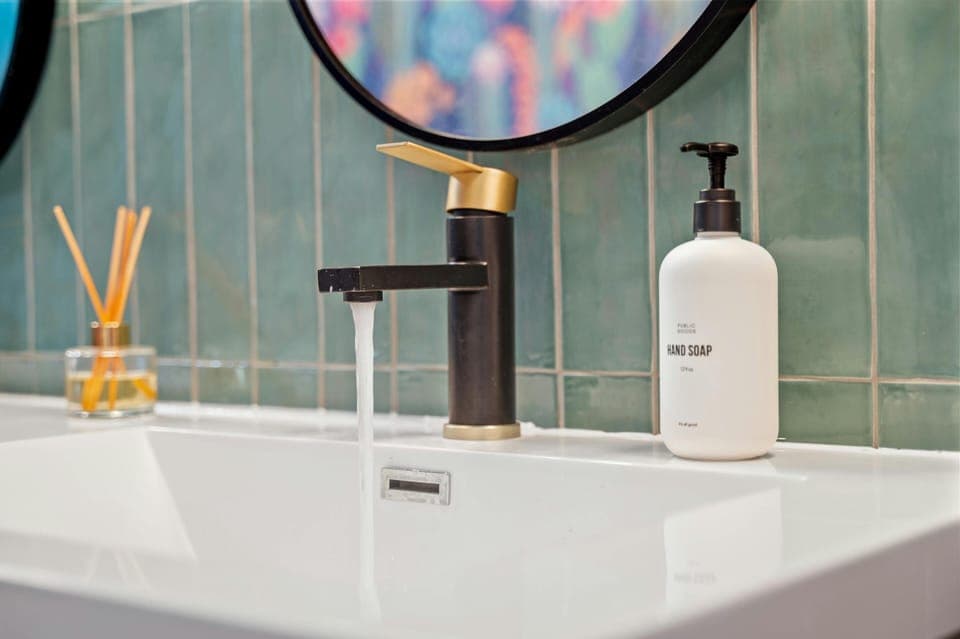 Unique gold accents in vanity