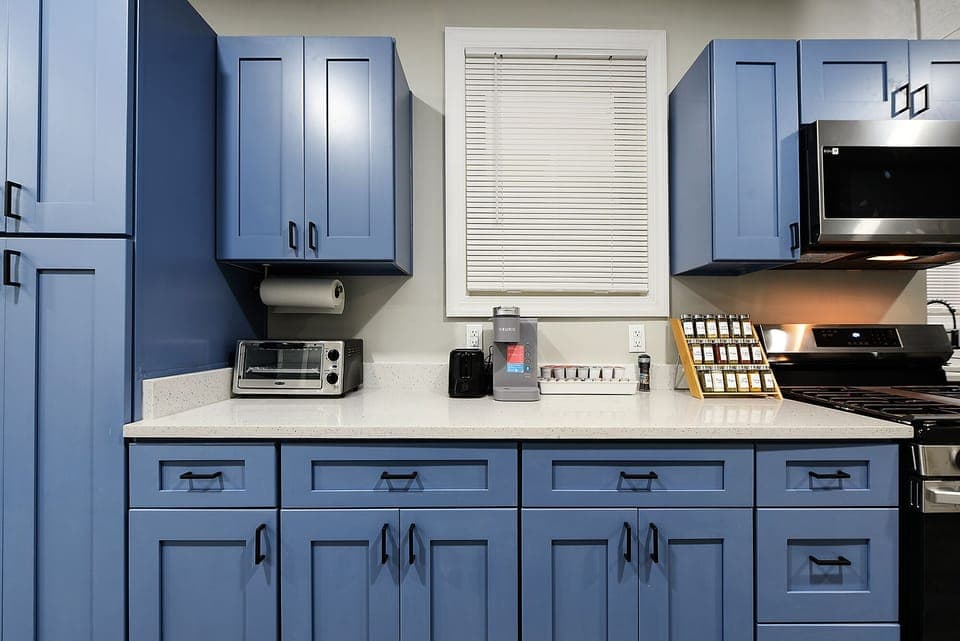 The recently remodeled cabinets complement the color palette of this property. 