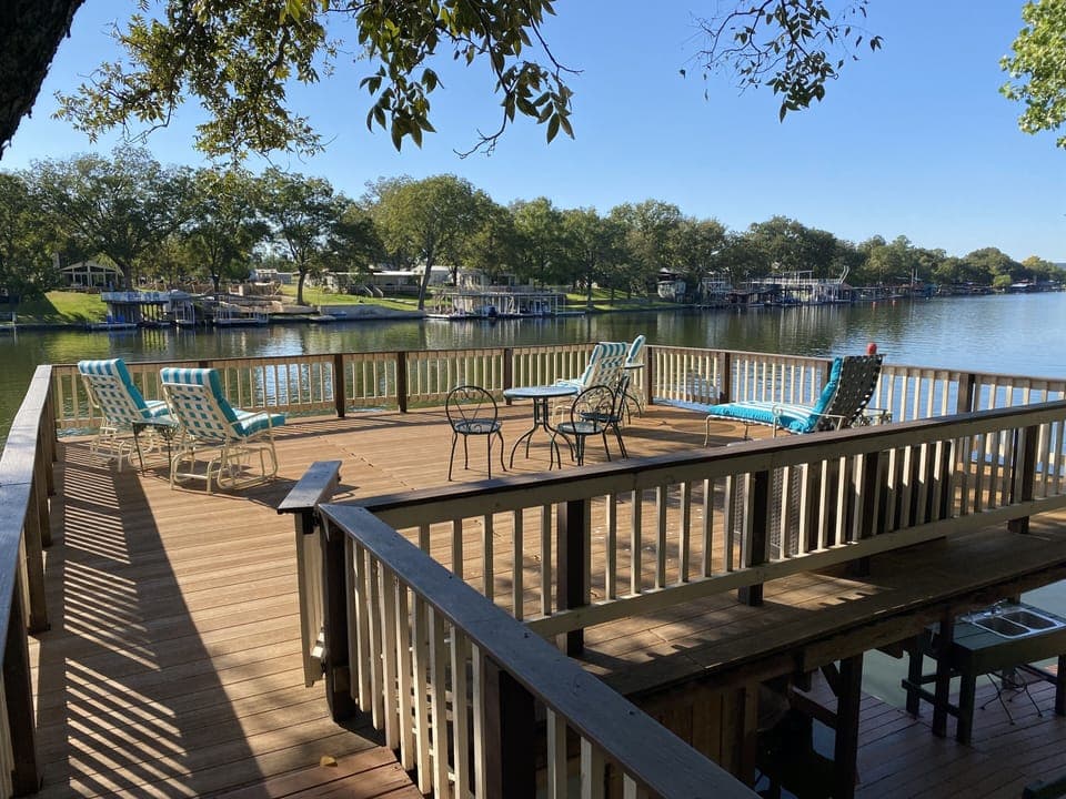 Enjoy relaxing breezes on our boat house deck right on the lake