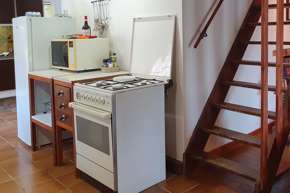Kitchen, with stairs to the 2nd floor.